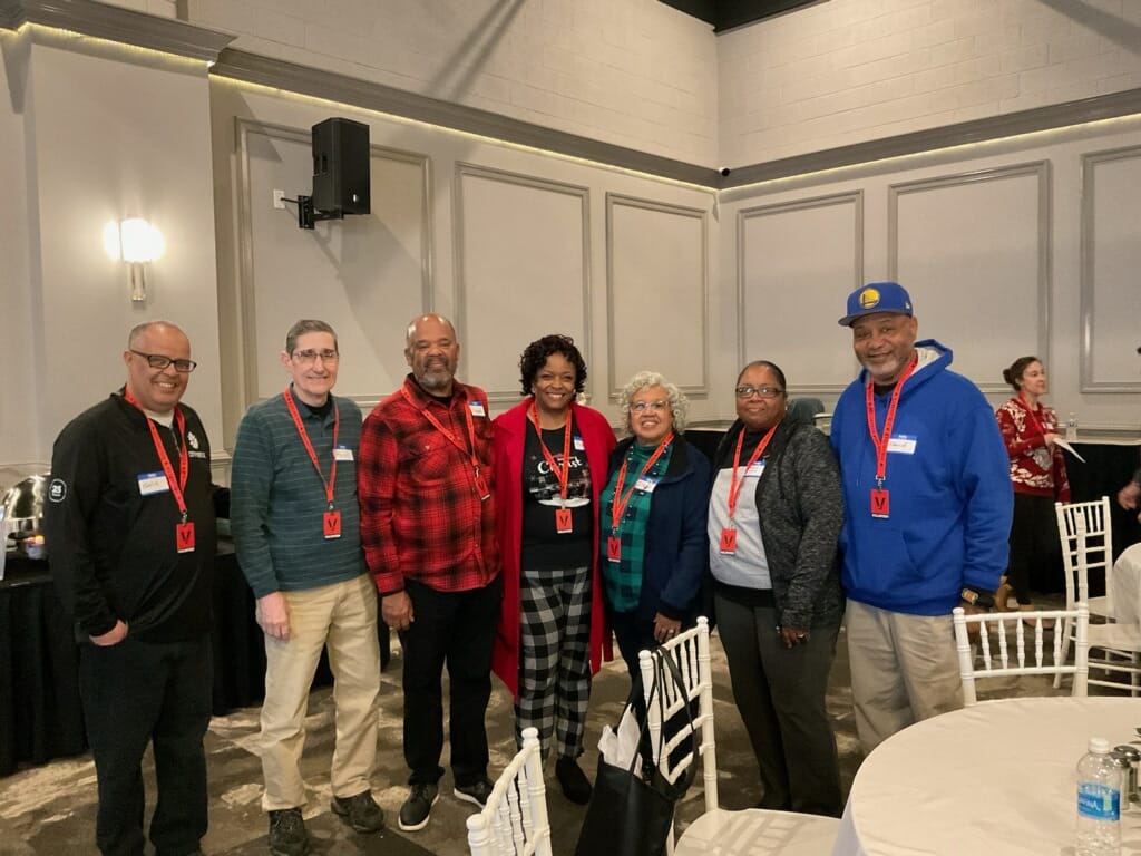 Celebrating at the Angel Tree Prison Ministry Christmas Party are Pastor Chafik, Paul, Richard, Rachel. Irene, Alfredia, and Pastor Edward
